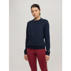 woman facing forward wearing the |Tommy Hilfiger Illinois graphic sweatshirt in a dark navy blue they call desert sky