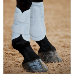 Eskadron Mesh Tendon Boots Powder Blue on a dark bay horse in a sand school