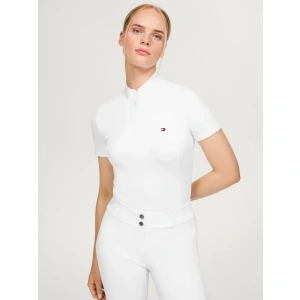 The Tommy Hilfiger Avon Short Sleeve Show Shirt in Optic White is where timeless elegance meets modern performance, making it the perfect choice for riders who want to look and feel their best in the show ring. Crafted from a refined blend of 84% nylon and 16% spandex, this shirt delivers a sleek, slim fit that flatters the silhouette while allowing complete freedom of movement—essential for any serious competitor.