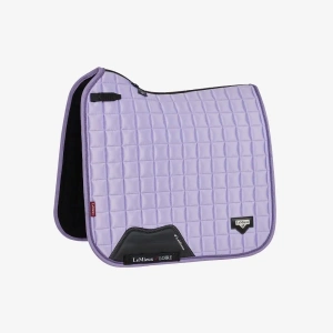The LeMieux Loire Dressage Saddle Pad Wisteria blends timeless elegance with modern performance, making it a standout choice for riders who demand both style and function. Often described as LeMieux’s most stylish dressage pad to date, the Loire collection strikes the perfect balance between subtle sophistication and technical excellence.